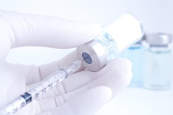 Botox-type injectable drawn into syringe from vial